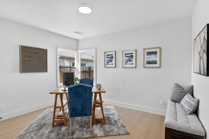 Office area featuring baseboards and light wood-type flooring