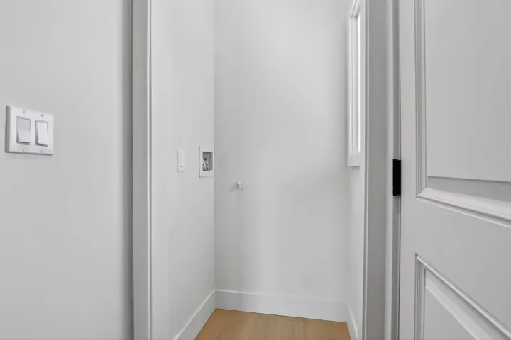 Detailed view of wood finished floors and baseboards