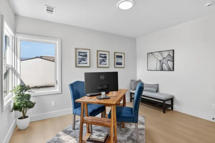 Office area with light wood finished floors and baseboards