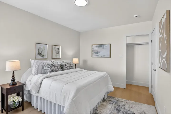 Bedroom featuring light wood finished floors and baseboards