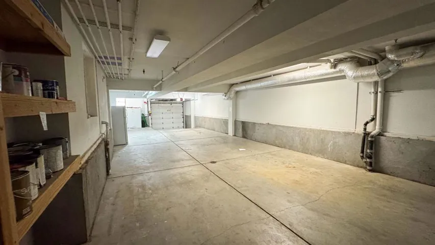 Garage with freestanding refrigerator
