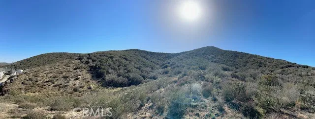 Standing on flatter area, looking to the South. No rear neighbors. Property up against Sierra Paloma Mountain range.