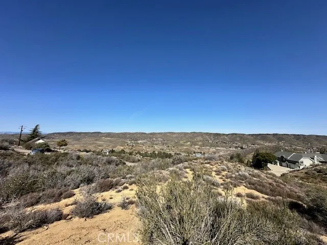 Property nestled between and to the South of the homes pictured on right and left of picture. No rear neighbors.