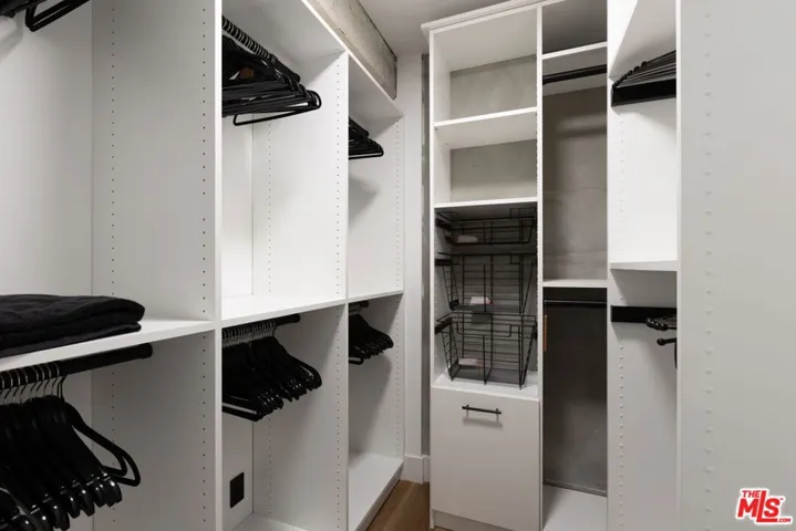 Walk-in closet in primary bedr