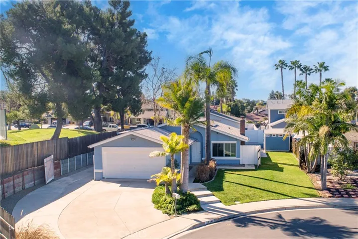 Front areal view of property with the side gates open