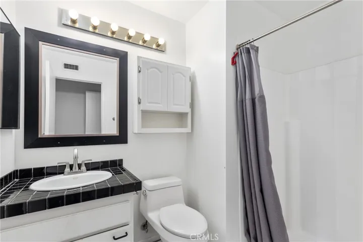 Primary bathroom with walk-in shower.