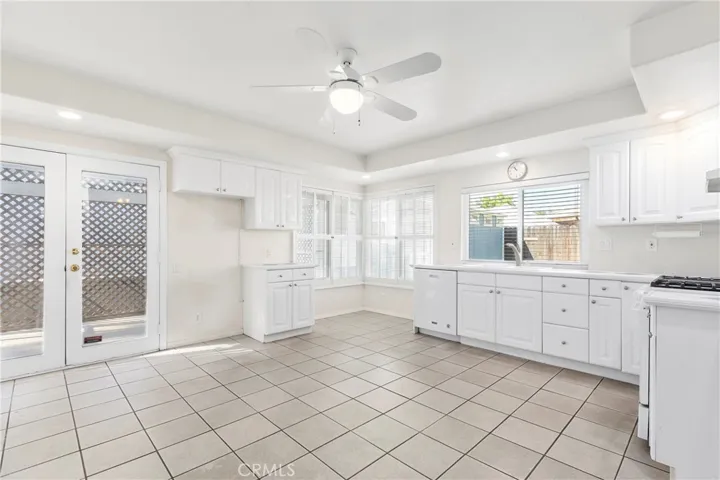 Family style kitchen looking out to the patio