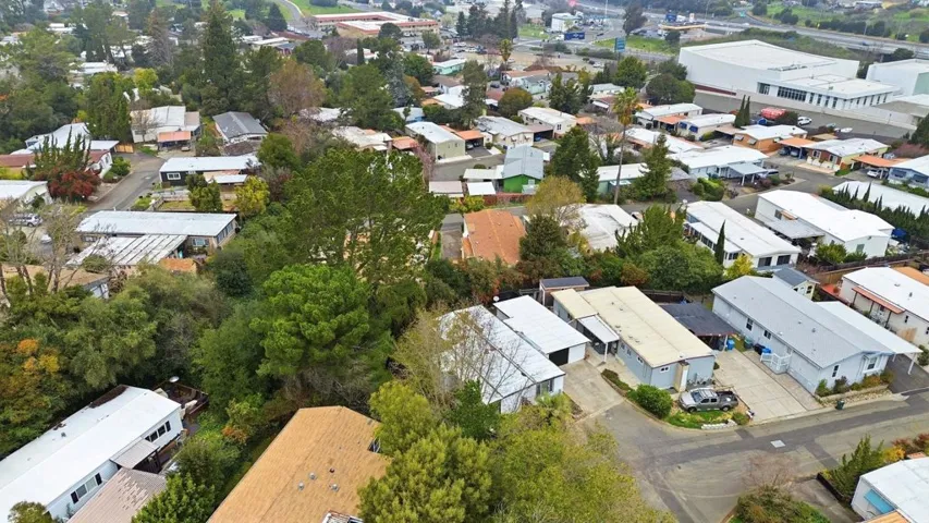 Aerial view of property's location featuring nearby suburban area
