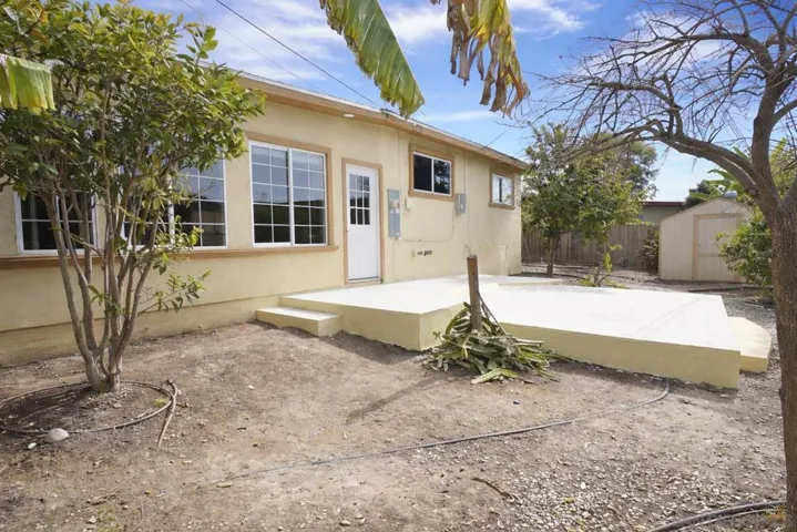 LARGE YARD WITH TILED PATIO