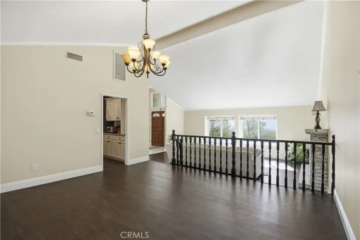 Formal Dining Room that leads to the Kitchen Area and Formal Family Room.