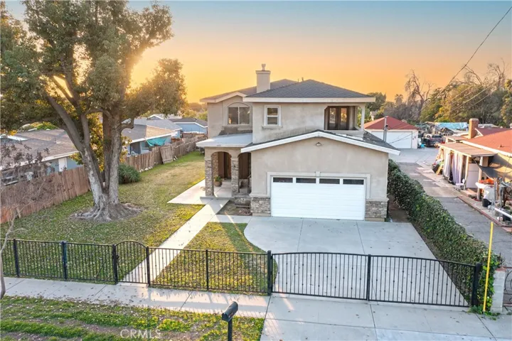 Fully fenced with 2 sets of double swing gates.