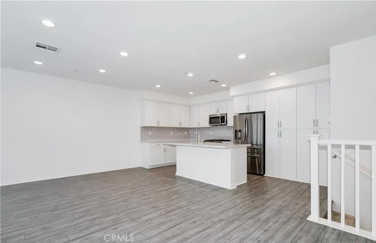 Open living room to kitchen