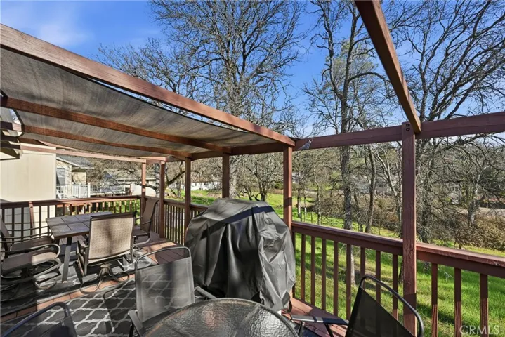 Large back deck has space for all of your entertaining needs.