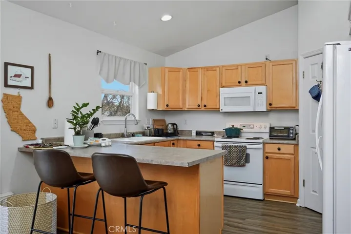 Kitchen has lots of counter space and lovely cabinetry.