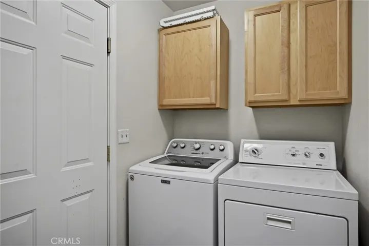 Laundry room is conveniently located between dining area and garage.