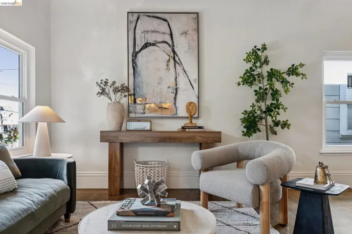Sitting room with wood finished floors and baseboards