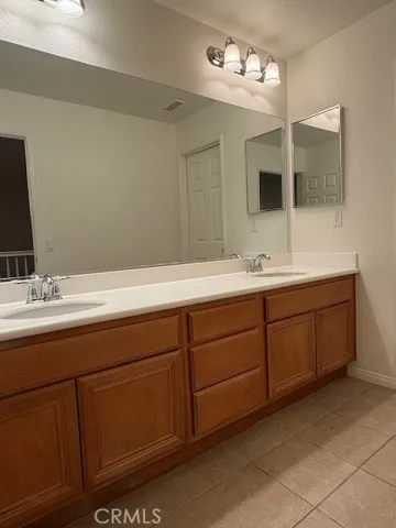 upstairs bathroom with double vanity