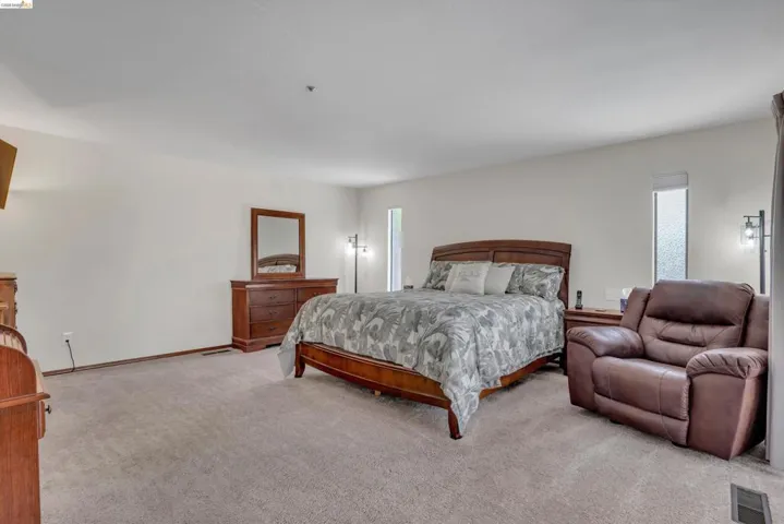 Bedroom with light colored carpet