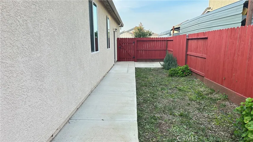 Wide side yard access with room to expand. Concrete walkway wrap around.