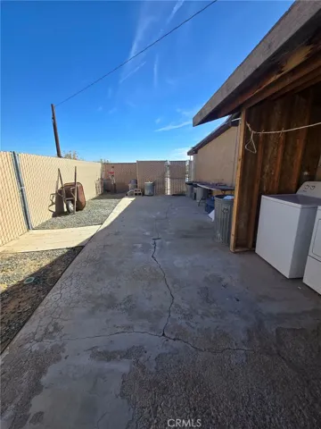 Concrete patio at laundry area.