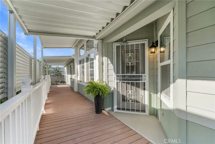 Front porch with composite decking amd privacy awning