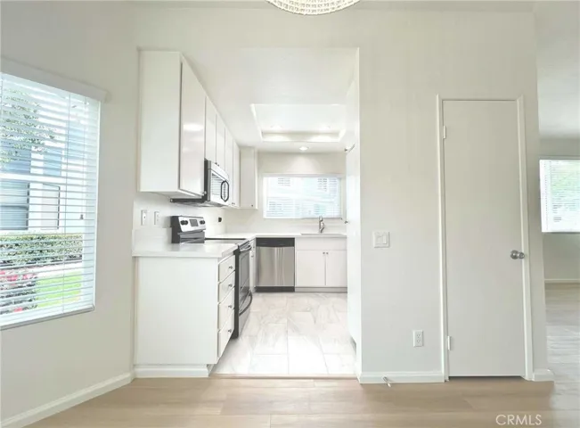 White cabinets with stainless steel appliances