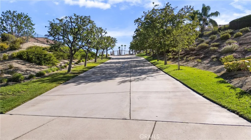 Expensive driveway leads to private gate