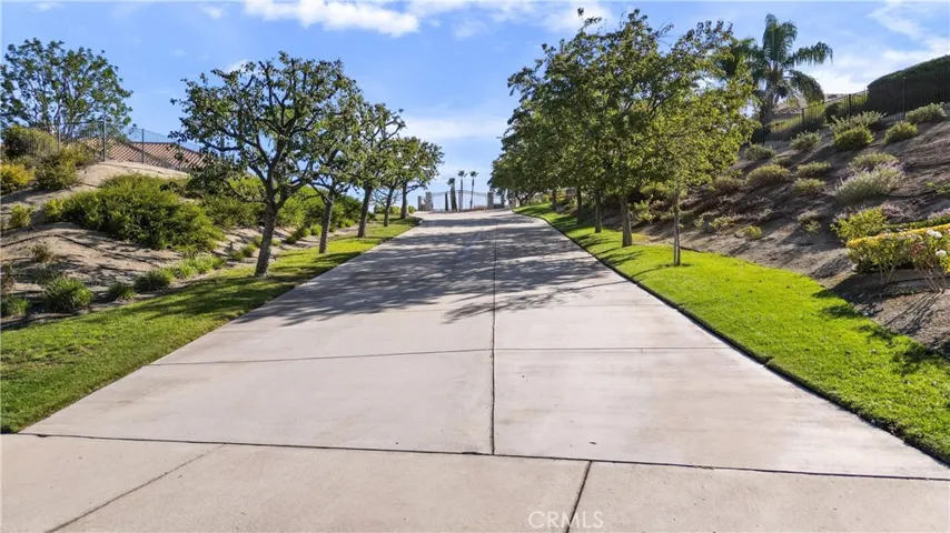 Expensive driveway leads to private gate