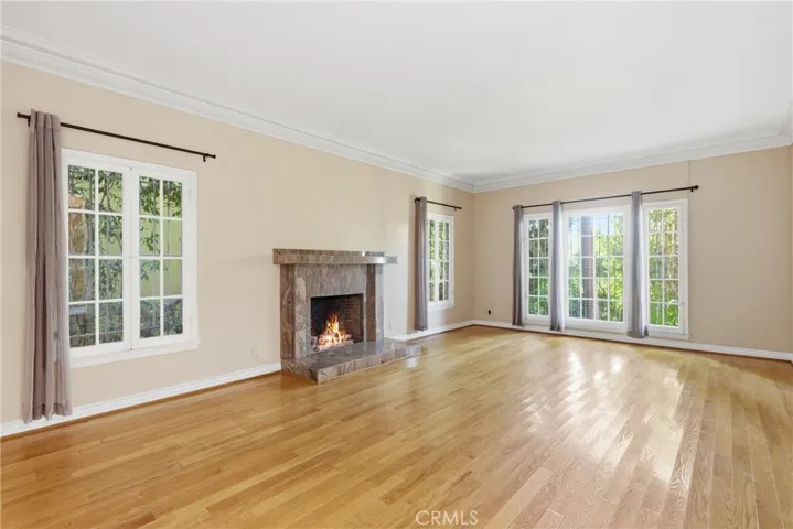 Living room with hardwood floors, fireplace & French doors