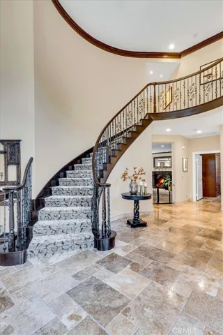 Beautiful curved staircase adds to the dramatic entrance