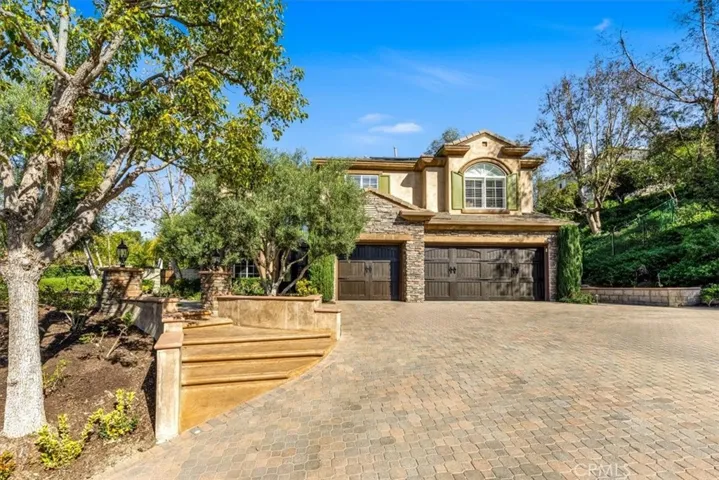 Oversized driveway with beautiful pavers add to the curb appeal!