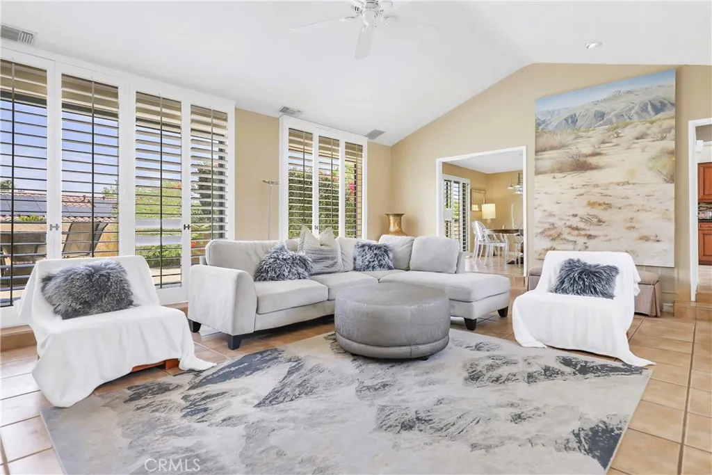 Open living room that is bright, luxurious with soothing  neutrals decor.