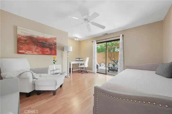 Room with sliding door to private patio