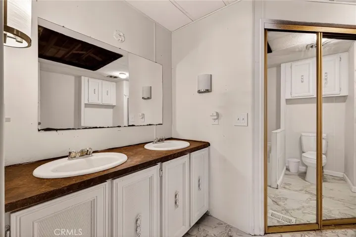 Primary bath with large walk in closet