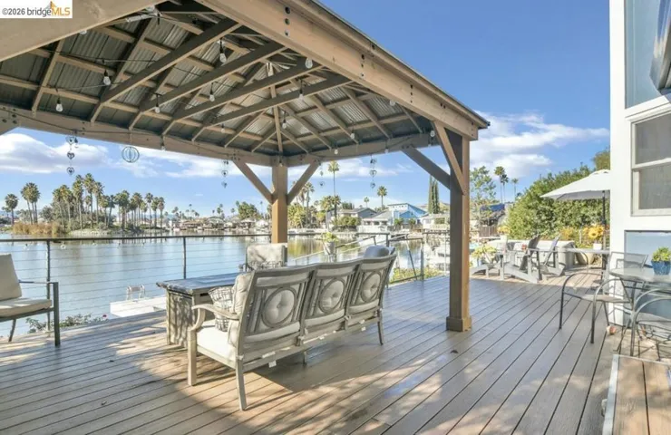 Dock with a deck with water view and a gazebo