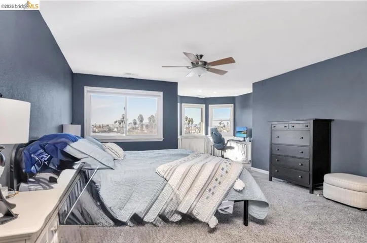 Bedroom featuring carpet and ceiling fan