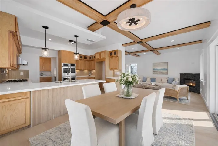 Virtually staged dining room, kitchen, and living room