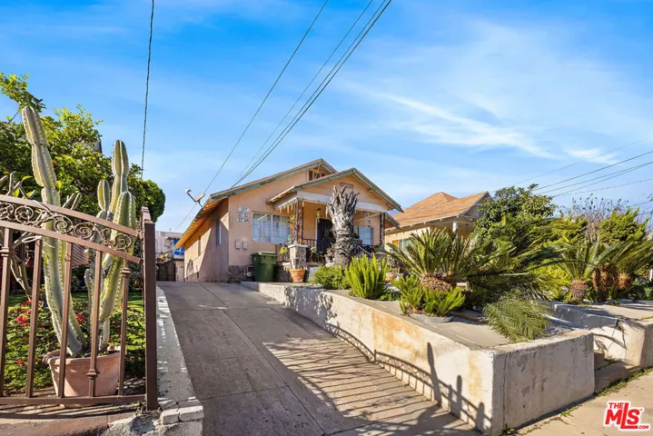 Sidewalk View of Property & Dr