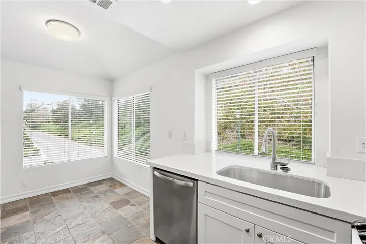 Dining area with view of landscaped hillside