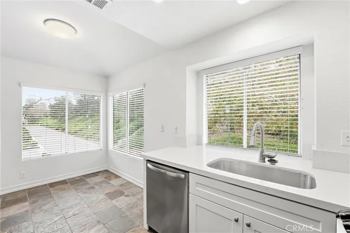 Dining area with view of landscaped hillside