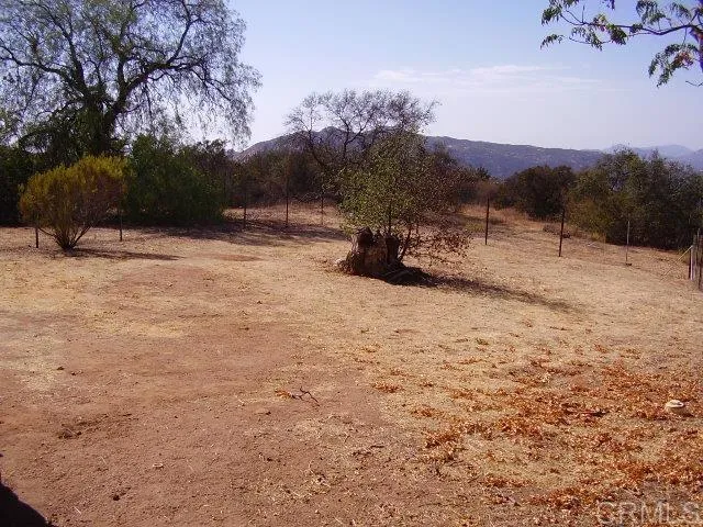 fenced rear yard off house