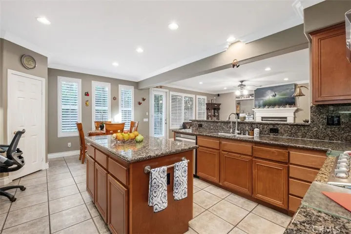 Kitchen opens to the family room, and connects to the formal dining room.