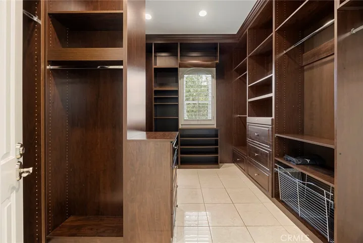 Walk-in Closet with Custom Built-in Cabinets