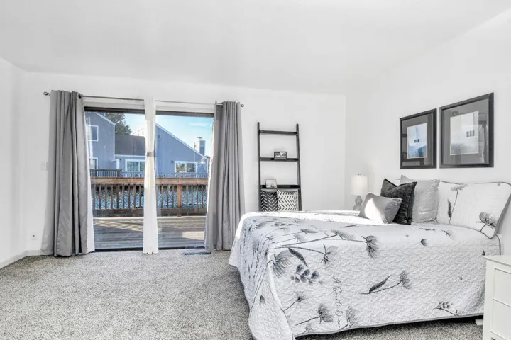 Spacious Primary Bedroom with Deck Access and Lake Views