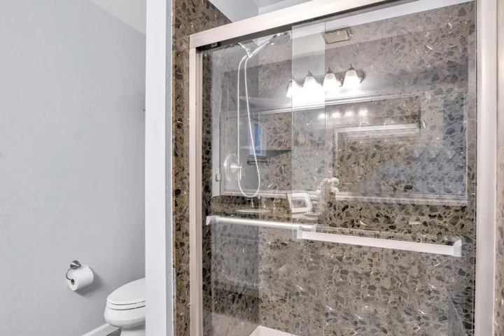 Large Shower with Granite Surround in Primary Bathroom