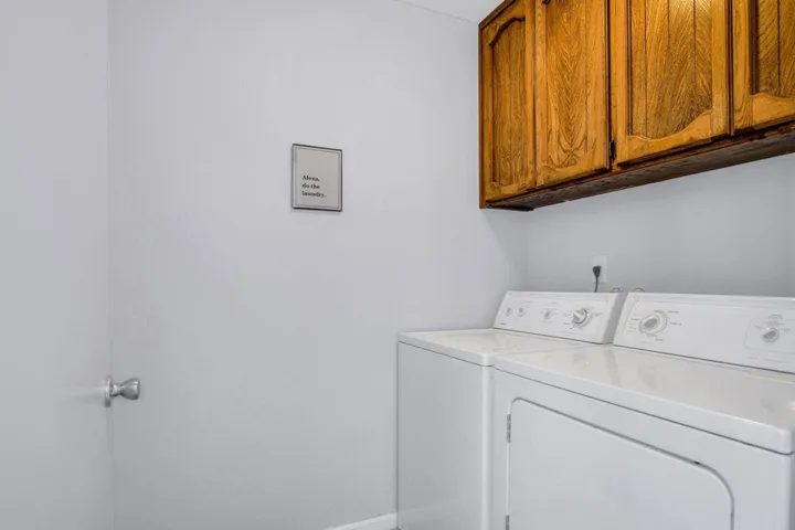 Laundry Room Equipped with Washer & Dryer