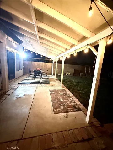 SPACIOUS COVERED BACK PATIO WITH PLENTY OF SPACE TO ENTERTAIN