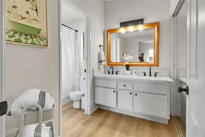EN-SUITE REMODELED  PRIMARY BATHROOM WITH DOUBLE SINKS  AND SEPARATE TUB/TOILET CLOSET
