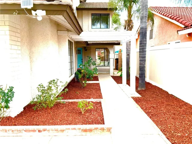 BEAUTIFUL ENTRYWAY LINED WITH FABULOUS ROSE BUSHES