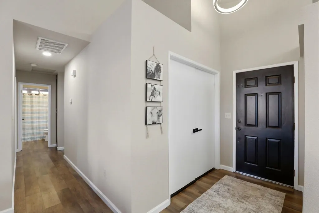 Entrance foyer with dark wood-type flooring